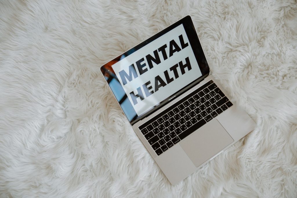 the words mental health on laptop screen 3958406